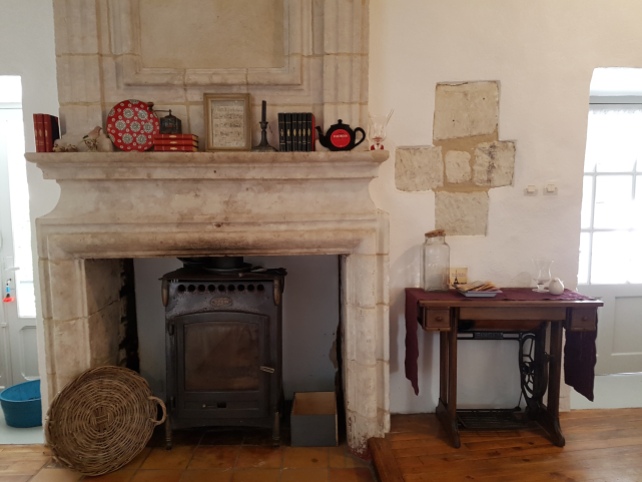 Stone fireplace with Godin wood burner